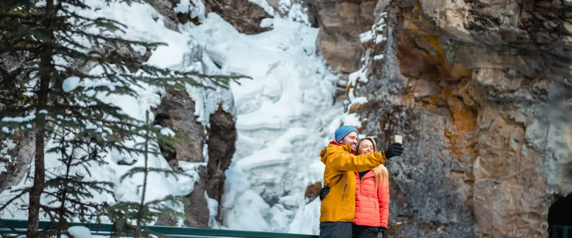 Photos at Johnston Canyon's lower falls on a guided icewalk with Discover Banff Tours