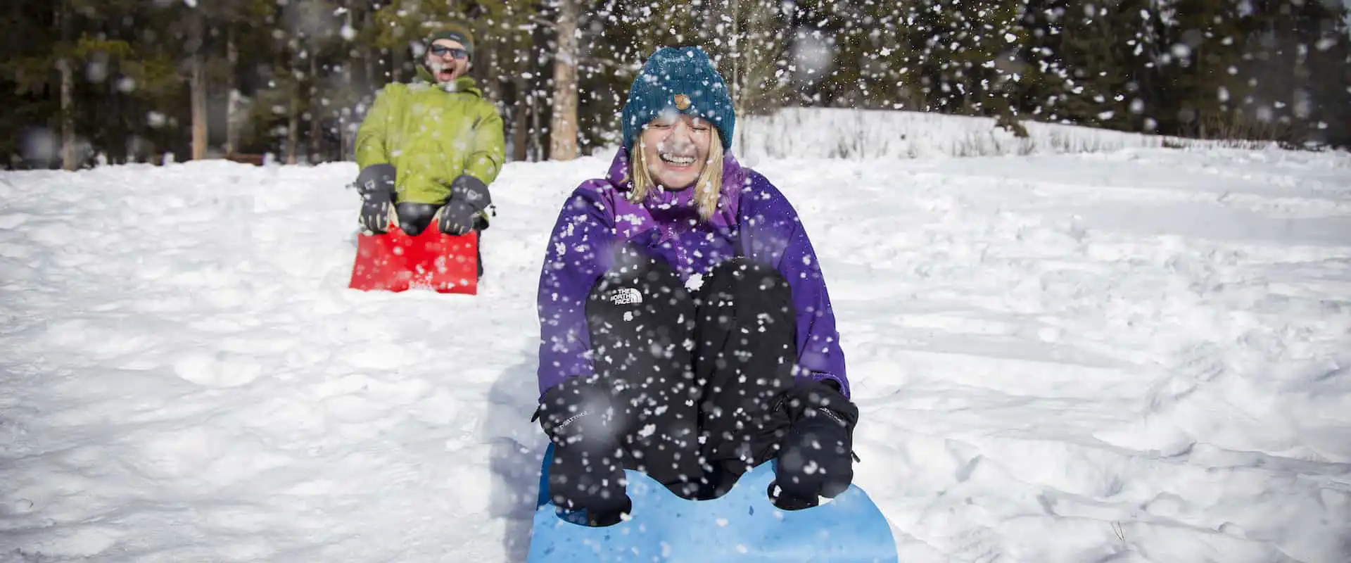 Take a crazy carpet slide on the Snowshoeing Tour to the Paint Pots with Discover Banff Tours to the Canadian Rockies