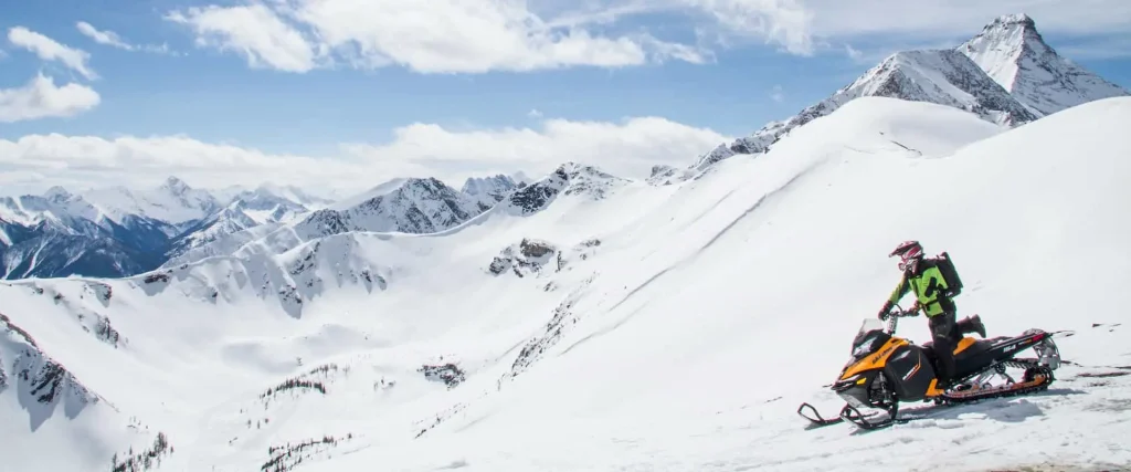 Ride a snowmobile in an open powder bowl with Toby Creek Adventures