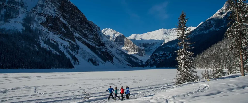 Take a walk along the Lake Louise shoreline trail on the Discover Lake Louise winter tour