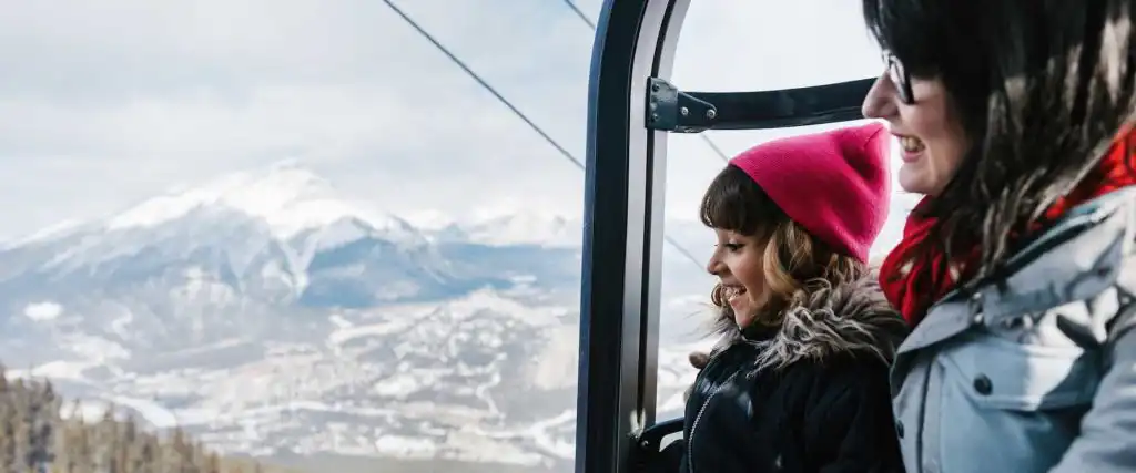 See views over Banff from the gondola cabin